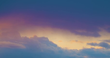 Wall Mural - movement of clouds in the colorful evening sky.