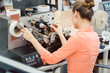 © Kzenon - Woman working on label printing machine