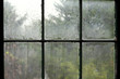 Rainy day viewed through an old window. 