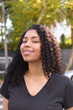 © Gustavo - Black woman on urban background in casual clothing