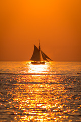 Tall ship sailing at sunset on Lake Michigan in South Haven Michigan