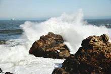Waves Breaking Against Sea