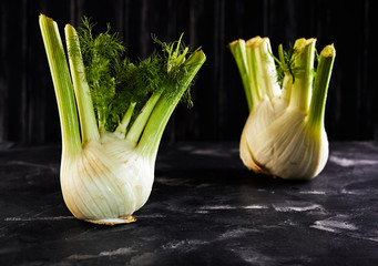 Poster - Fresh organic fennel bulbs on black background