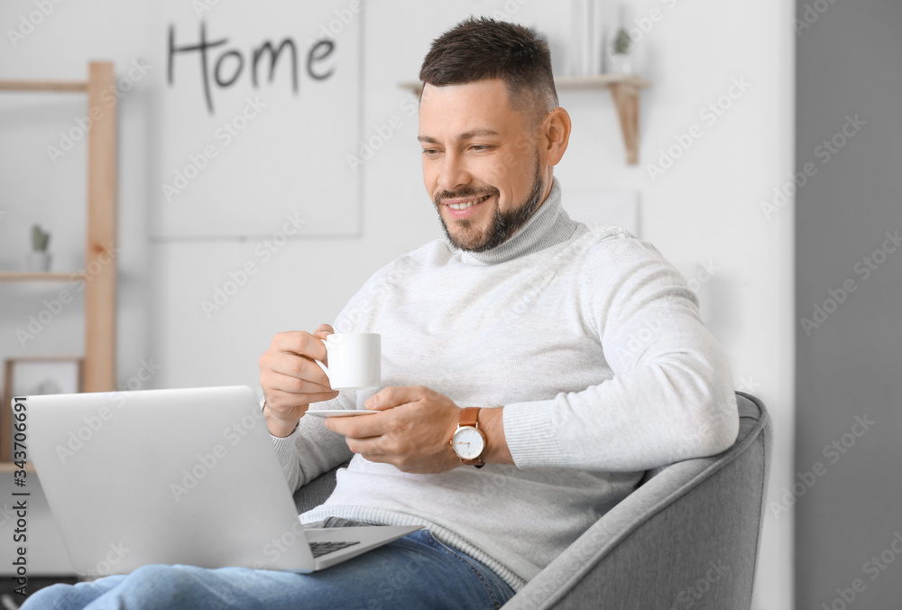 Handsome businessman working at home