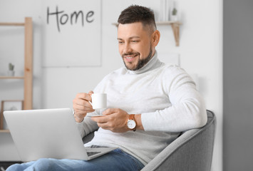 Canvas Print - Handsome businessman working at home