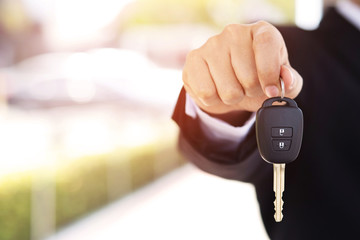 Car key, businessman handing exchange over give to the other man. Seller dealer credit Interest payment or purchase by installment car concept.