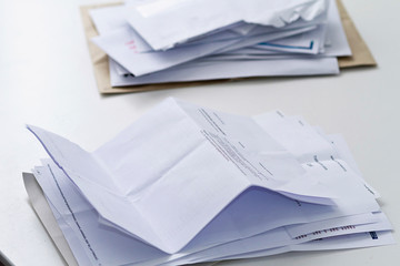 A stack of professional or invoice letters