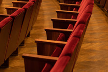 Dark Red Soft Velvet Chairs In The Theater Hall
