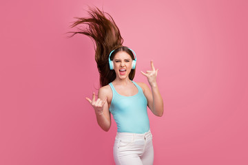 Sticker - Portrait of her she nice attractive lovely cheerful cheery straight-haired girl having fun showing horn symbol listening song silky hair flying isolated on pink pastel color background