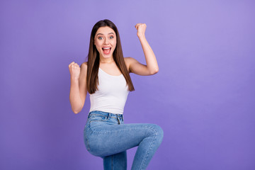 Poster - Portrait of astonished positive cheerful girl hear she win incredible sale discount lottery raise fists scream yeah wear good look outfit isolated over purple color background