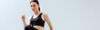 © LIGHTFIELD STUDIOS - panoramic shot of attractive woman in black sportswear exercising isolated on white