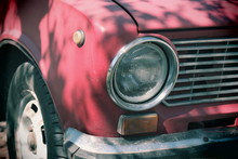 Headlight Of A Vintage Car. Old Car Of Red Color. Vintage Car Body