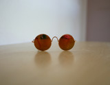 Fototapeta  - Mini sunglasses for small pet like cat or dog on wooden floor