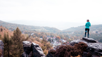 Successful woman enjoy the view on mountain top sandstone rock. Outdoor healthy lifestyle summer vibes