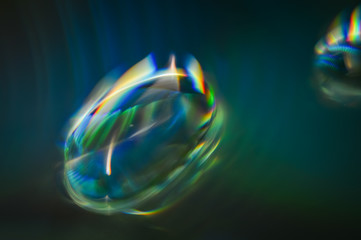 Light diffraction showing rainbows on water drops -colorful abstract background