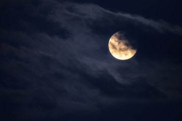 full moon in the clouds at laconi