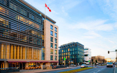 Wall Mural - Street with modern building with Canadian flag on Potsdamer Platz reflex