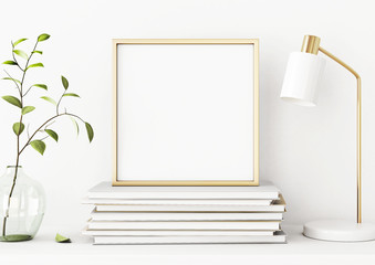 Aufkleber - Interior poster mockup with square gold metal frame on pile of books, green tree branch in vase and desk lamp on empty white wall background.  3D rendering, illustration.