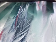 Low Angle View Of Windshield In Car Wash