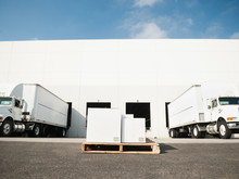 Warehouse With Trucks And Load