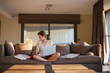 © Jan Scherders/Tetra Images - Young woman working from home