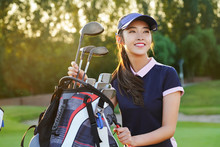 Confident Young Women To Take Golf Clubs