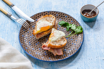 Canvas Print - Egg-in-the-hole bacon sandwich cut in half