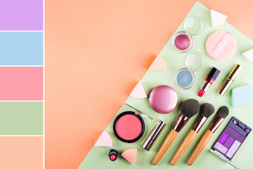 Wall Mural - Make up accessories on orange cantaloupe and mint green background. Beauty products colorful fashion flat lay Color swatch