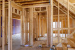 © Cavan Images - Framing beam of new house under construction home framing
