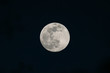 © Cavan Images - View of the full moon with visible craters on a dark night sky