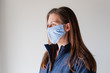 © Cavan Images - Woman wearing homemade cloth face mask during Covid 19 pandemic.
