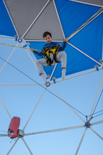 Low Angle View Of Boy Bungee Jumping At Trampoline