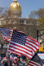 Activists With American Flags In Front Of A Government Building