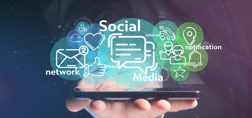 Wall Mural - businessman holding a cloud of social media network icon