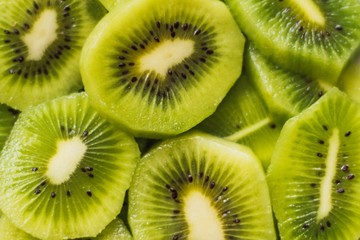 Sticker - High angle closeup shot of delicious sliced kiwi fruits