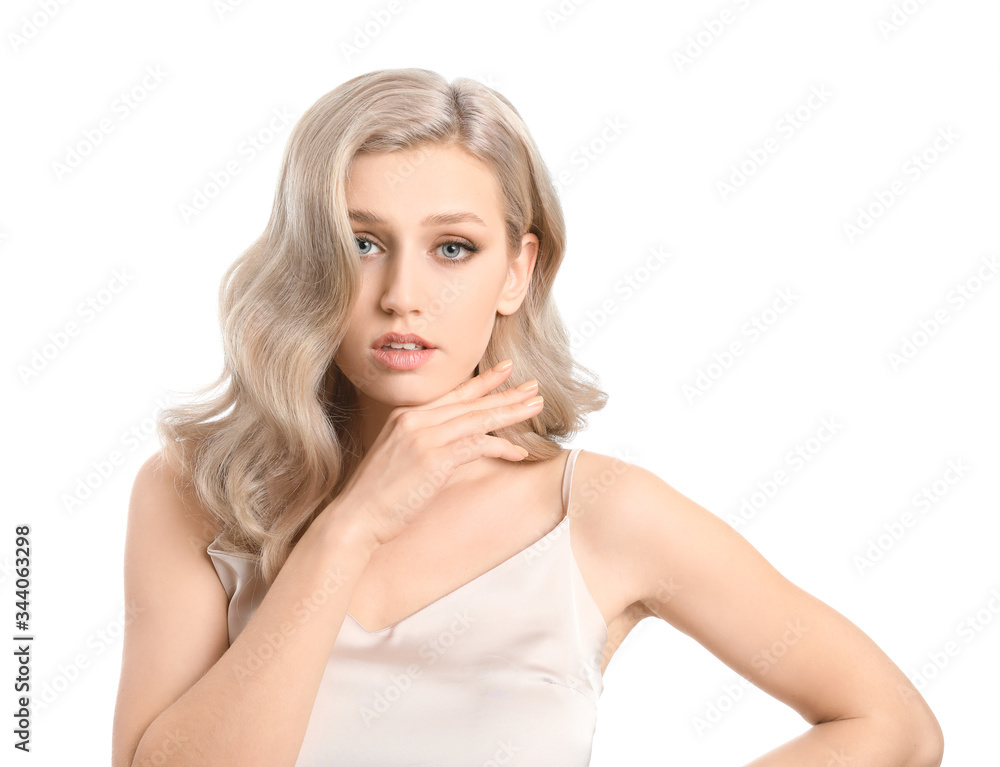 Young blonde with beautiful hair on white background