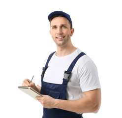 Male truck driver with notebook on white background