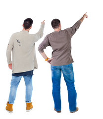 Back view of two man in sweater pointing.