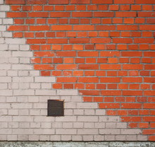 Diagonally Painted Red And White Brick Wall