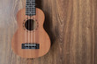 © 28foto.com - Brown ukulele guitar portrait on texture Wall plaster ,Vintage dark tone holiday relax break time with music or art concept with copy space for your text
