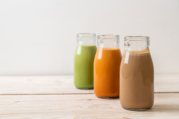 Wall Mural -  Thai milk tea, matcha green tea latte and coffee in bottle