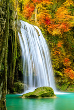 Colorful Majestic Waterfall In National Park Forest During Autumn