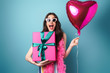 © Drobot Dean - Photo of delighted young woman posing with balloon and gift box