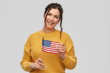 People Concept - Happy Smiling Young Woman With Pierced Nose With Flag Of United States Of America Over Grey Background