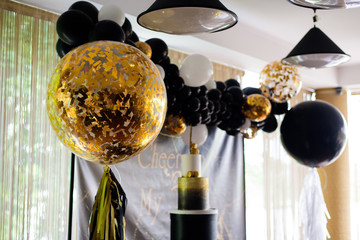 Wall Mural - Golden air balloon with sparkles on the birthday party