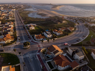 The marginal riverside, along the mouth of the Cavado River at sunset in Esposende, Portugal. The two sides of Restinga de Ofir. One facing the ocean, the other the estuary of Cávado River.