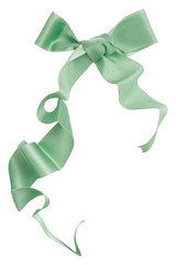 Wall Mural - Green ribbon curl isolated on white background. Bright green ribbon bow and curl isolated on white background. Textile accessories for sewing and gift scrapbooking decorations. Atlas or silk ribbon