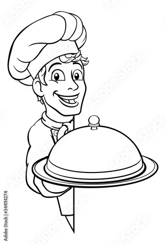 A chef holding a silver pla...