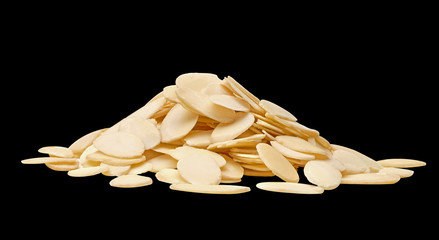 Wall Mural - Sliced almonds pile from top view  isolated on black background including clipping path.