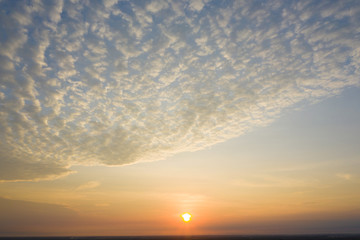 Wall Mural - Aerial view, art on the clouds from the sunrise